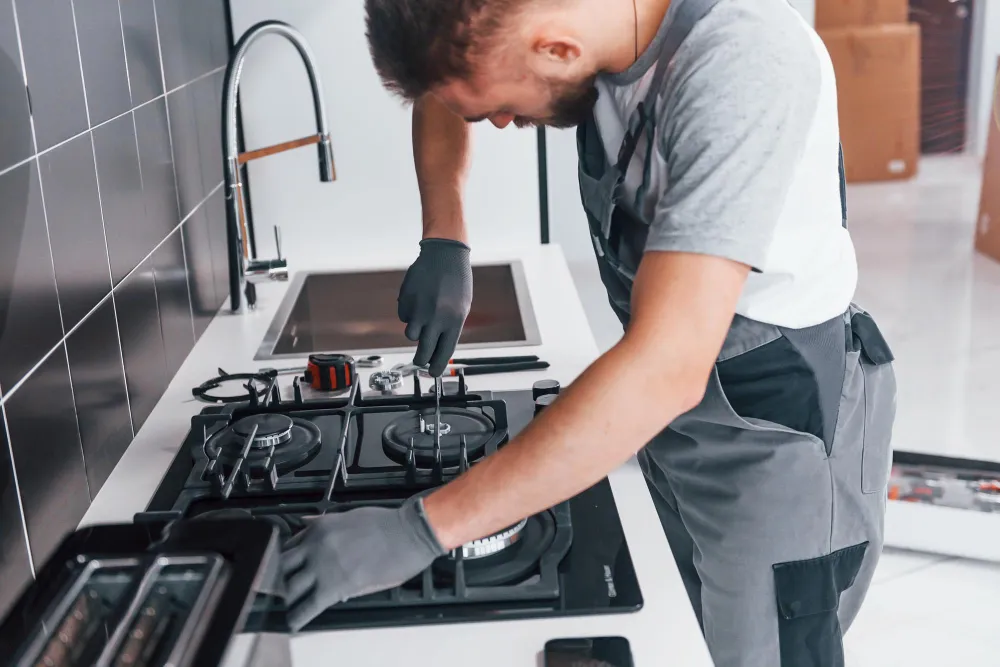 PrimoPeak technician servicing a stovetop